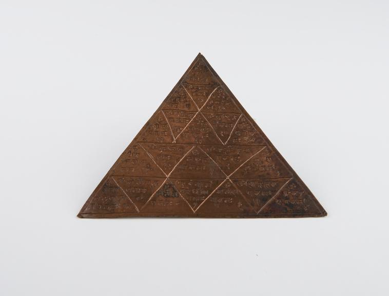 Triangular hindu meditation plaque called a yantra, copper