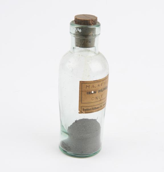 Bottle of iron filings with paper label marked Hopkins and