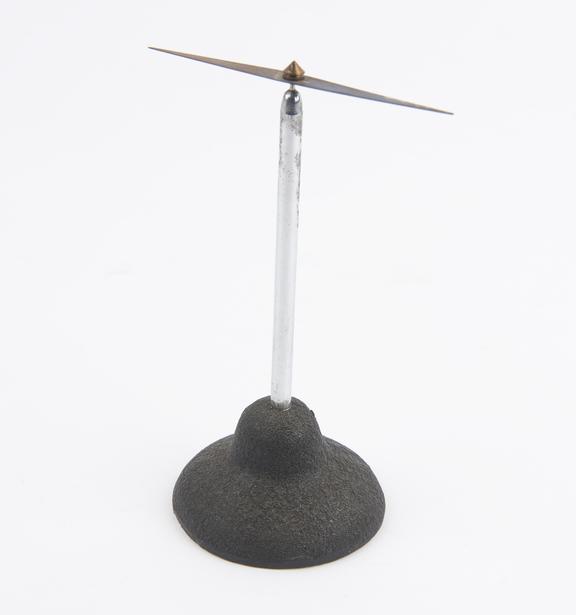 Magnetic needle mounted on a metal stand