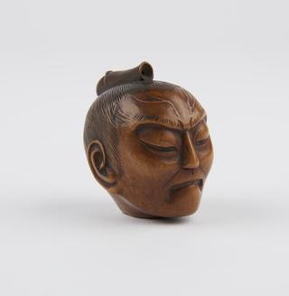 Netsuke in form of decapitated man's head