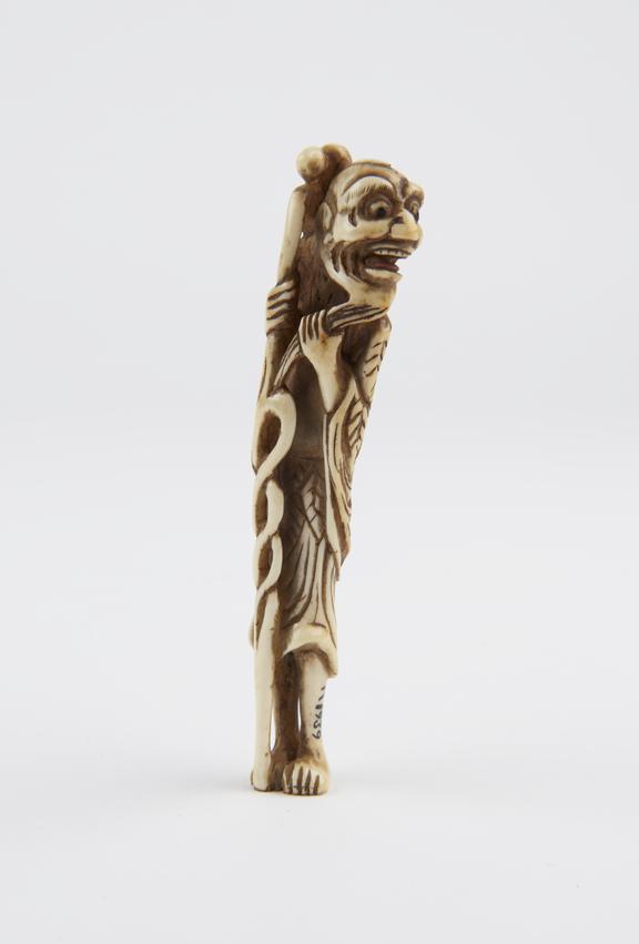 Ivory netsuke, in the form of Sennin with gourd and staff