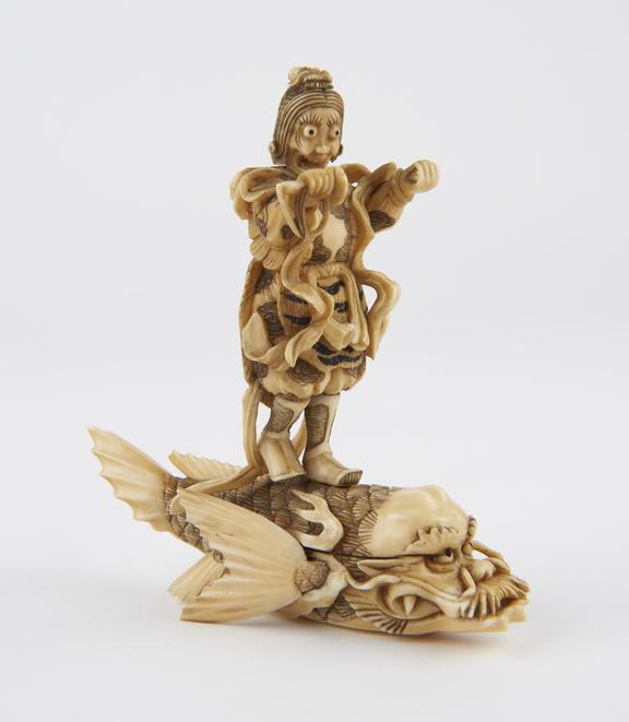 Ivory statue of a Japanese warrior riding on a fish, Japanese