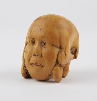 Model of head - half face, half skull