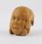 Ivory model of head one half of which depicts a face with skin