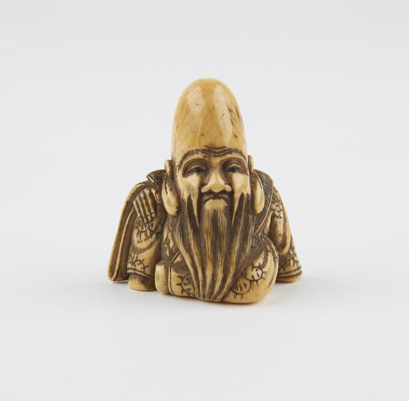 Ivory netsuke, in the form of the God Fukurokuju