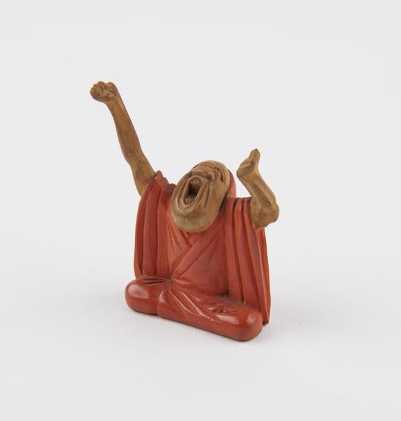 Wooden statue, possibly a netsuke, in the form of a man