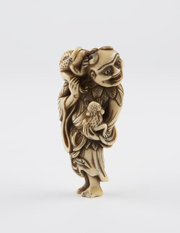 Ivory netsuke, in the form of Gama Sennin holding two toads