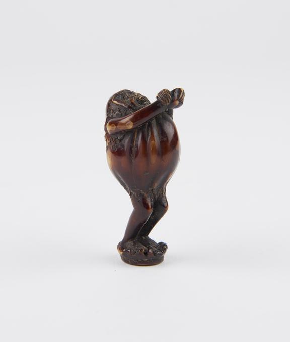 Ivory netsuke in the form of a very rotund male, stretching