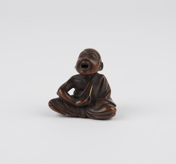 Wooden netsuke, in the form of a man