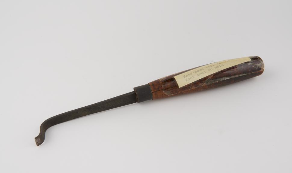 Hand-made tool for clearing foot area of the shin.