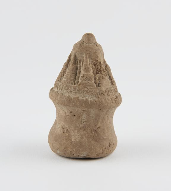 Buddhist clay amulet in form of model burial mound, Tibetan