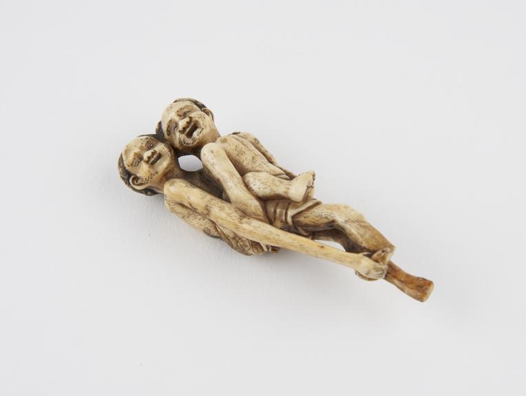 Ivory netsuke, in the form of two male figures