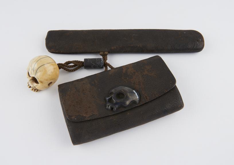 Tobacco pouch with pipe case and netsuke