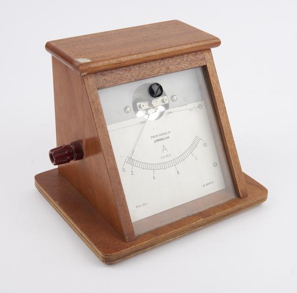 Moving-iron ammeter in angled wooden stand by Philip Harris Ltd