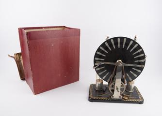 Wimshurst electrostatic machine with 20cm diameter ebonite plates and on decorated metal base