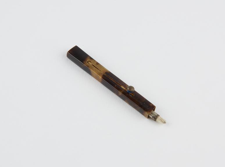 Double ended 'push art' brush in tortoiseshell case