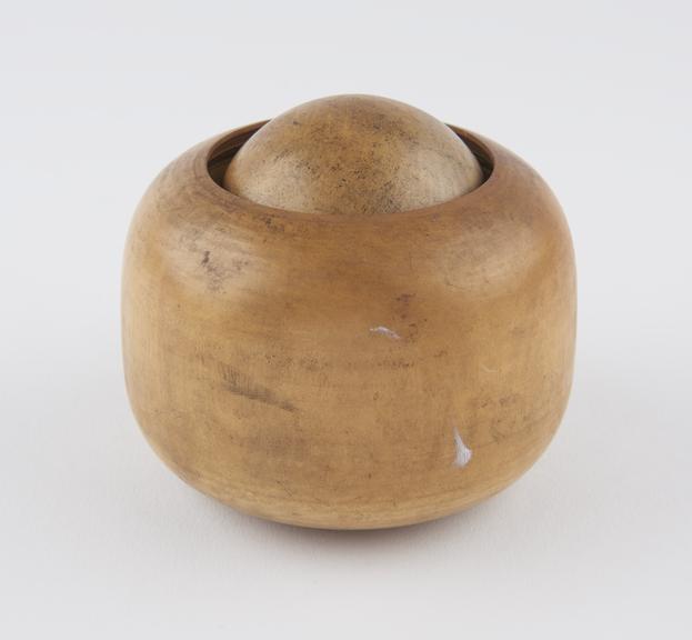 Turned boxwood massage ball in turned wooden socket, Japanese