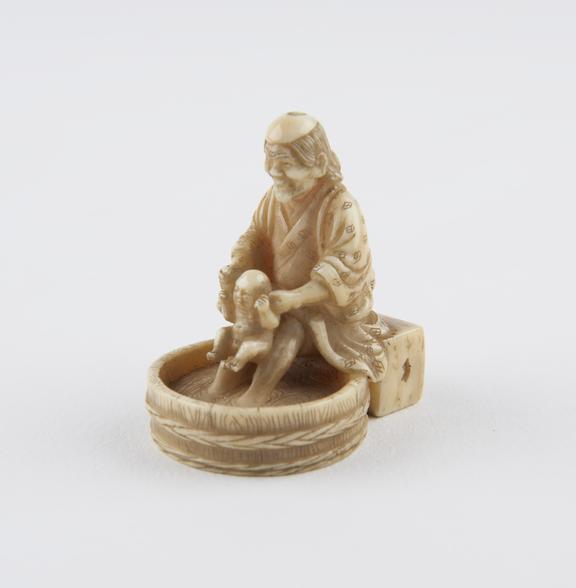 Ivory netsuke, in the form of a woman