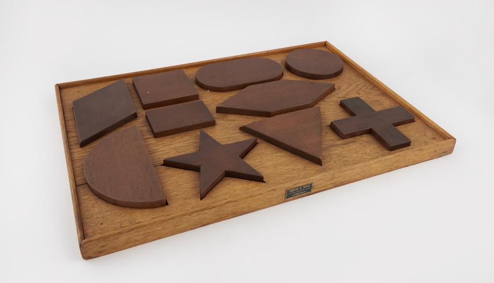 Wooden form board with ten shapes by Andrew H. Baird, Edinburgh