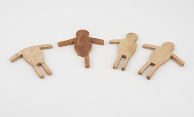 Four people shaped wooden pieces