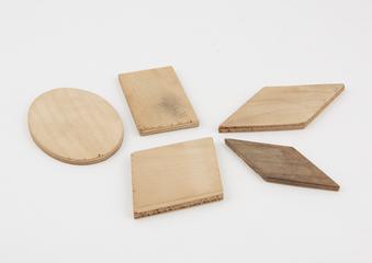 Five differently shaped wooden pieces