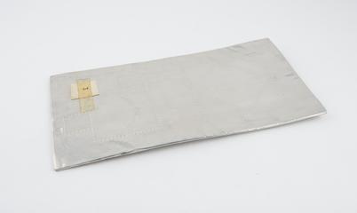 Foil covered board, with two pinhole patterns marked out on it