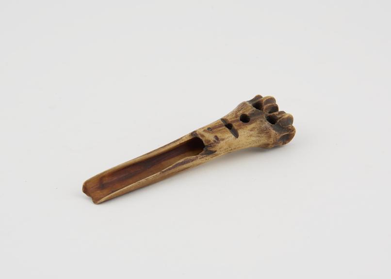 Apple scoop carved from sheep's tibia and decorated with