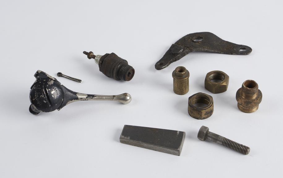 Ten assorted metal components from the three wheeled motor car