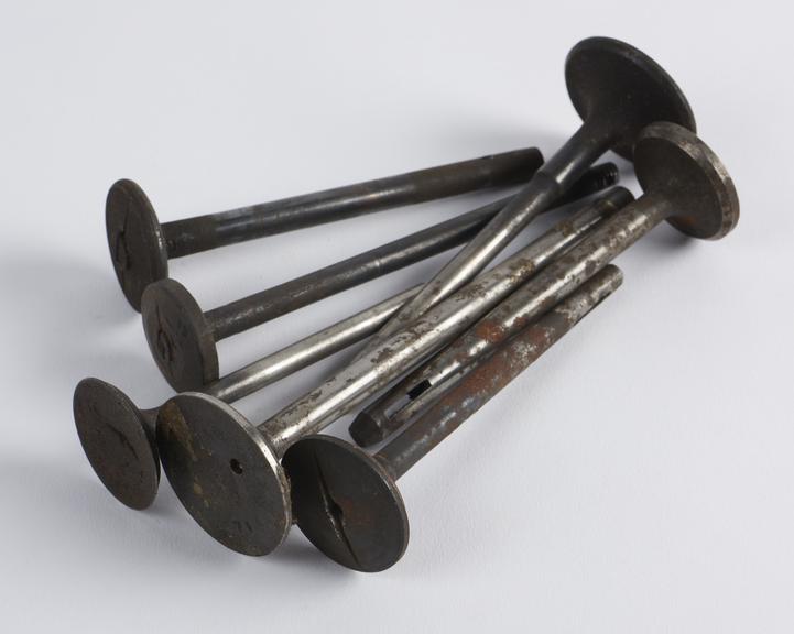 Seven metal pegs from the three wheeled motor car, by Benz