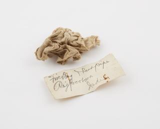 Rag containing remains of tinder