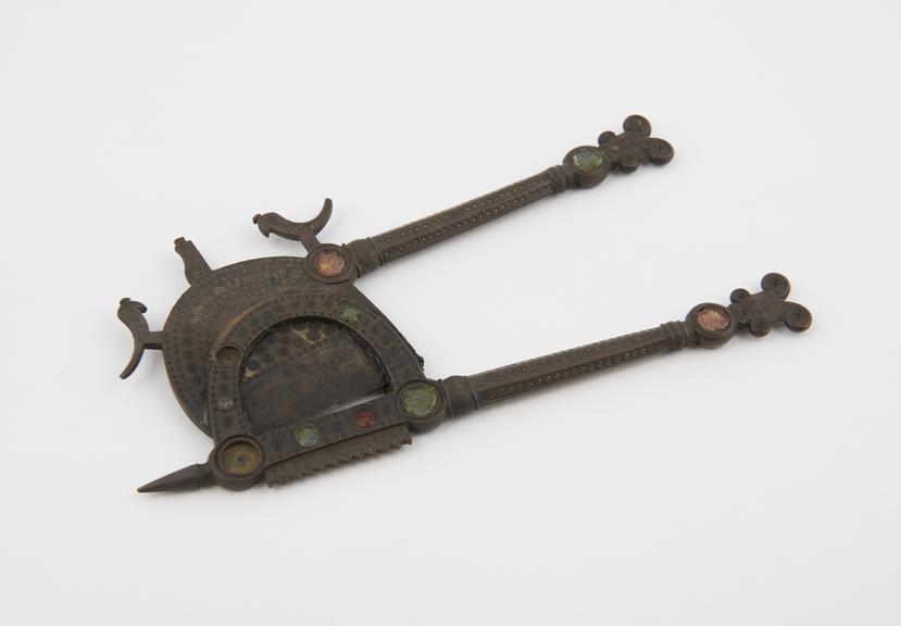 Bronze betel nut cutters, inlaid with glass circles, Indian