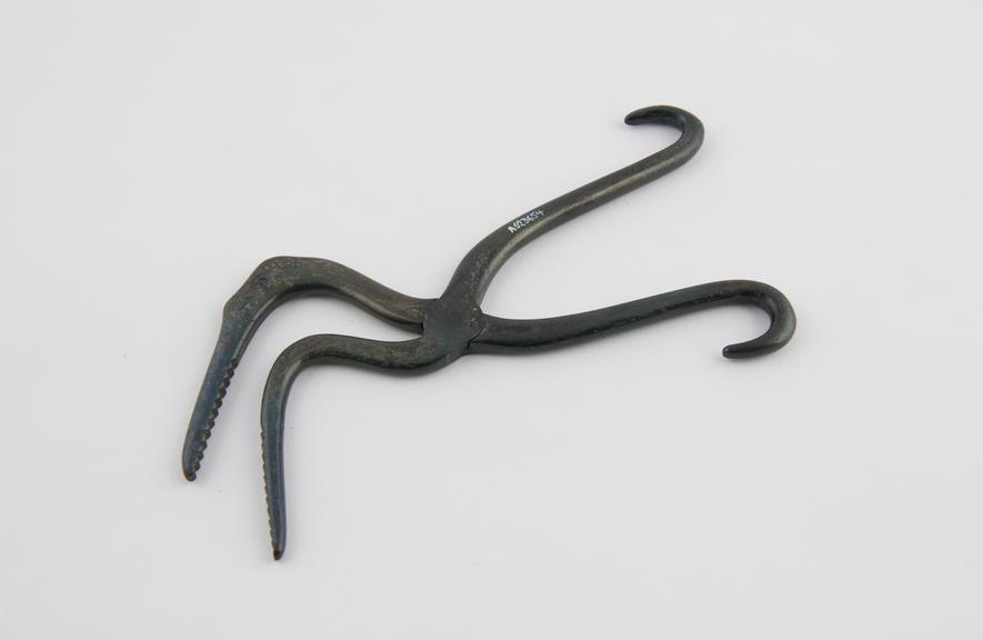 Copy of ancient crocodile forceps, makaramukha svastika, metal