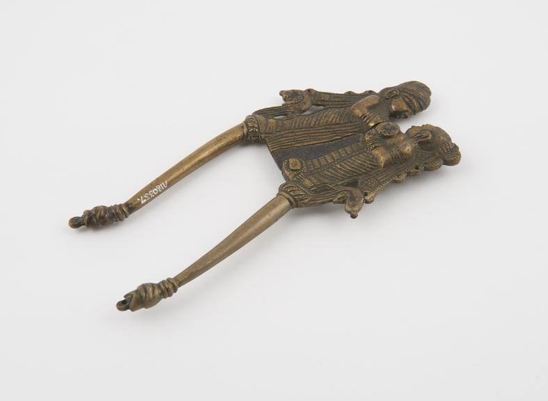 Brass betel nut cutters, with iron blade, two human figures