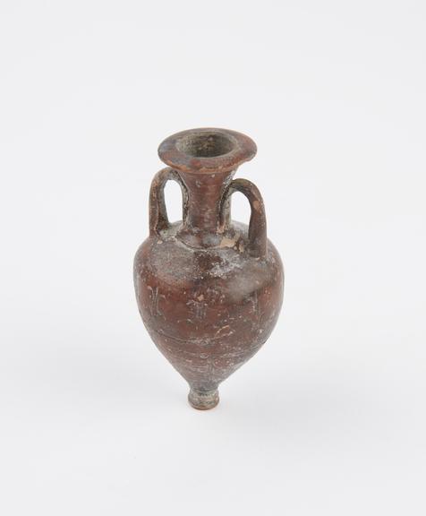 Miniature neck amphora, glazed with a stamped design, Attica