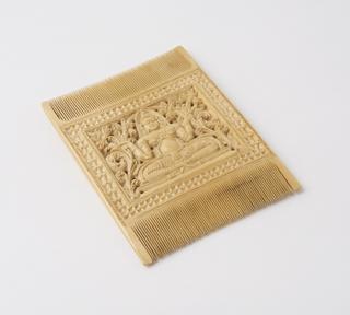 Rectangular double edged comb with image of Buddha