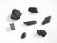 Several samples of natural black pebbles from various locations