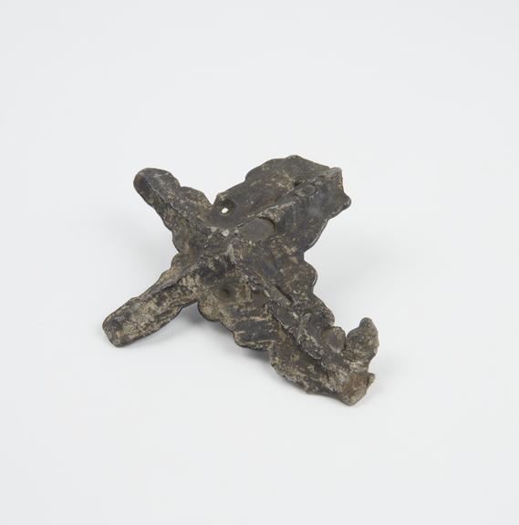 Crudely executed cross of lead