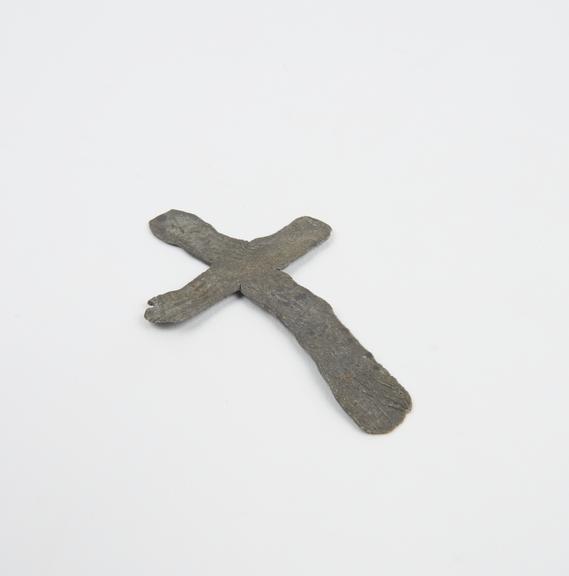 Crudely executed cross of lead placed on corpse of Black Death