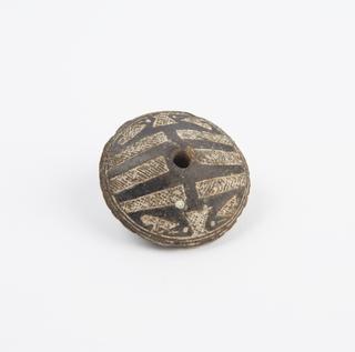 Spindle whorl, stone, hole through centre