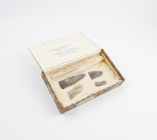 Cigar box, wood, containing four worked flint chisel heads