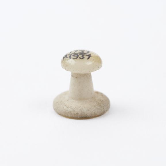 Small plastic knob for votive pony