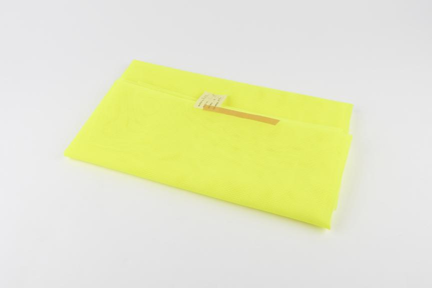 Sample of fluorescent yellow nylon warp knit fabrics