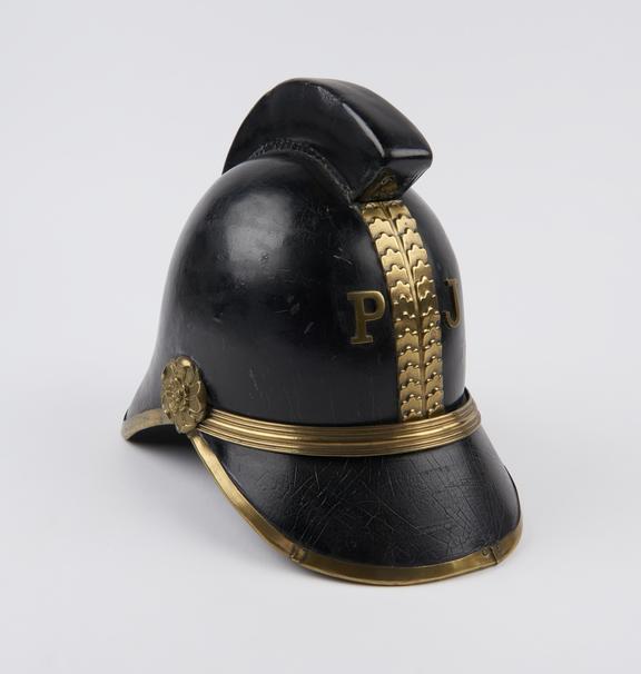 Old fireman's helmet, of black leather with brass edgings