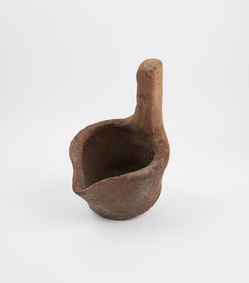 Large pottery ladle with short handle now broken, Egyptian(?)