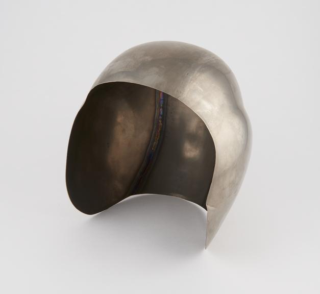 Aircraft helmet shape in titanium.