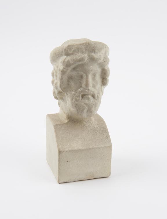 Plaster replica of a Greek statue, depicts head of Asklepios