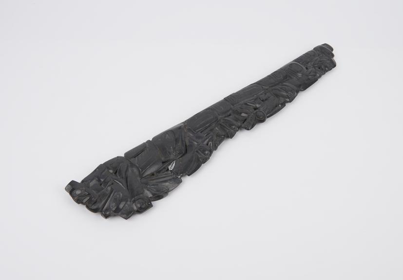 Shale pipe with carved decoration of stylised animals