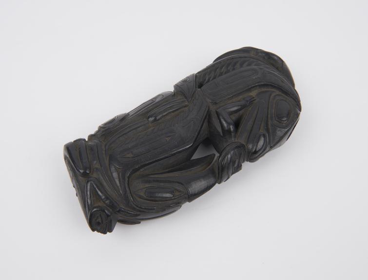 Black argilite tobacco pipe in the form of a block carved with