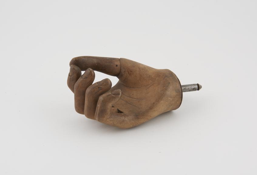 Right wooden hand with rigid fingers and spring thumb