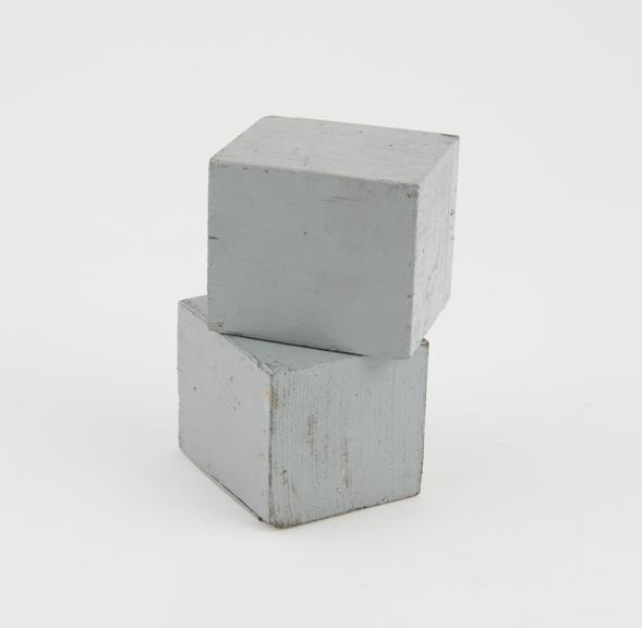 Two grey cubes, no maker marked.